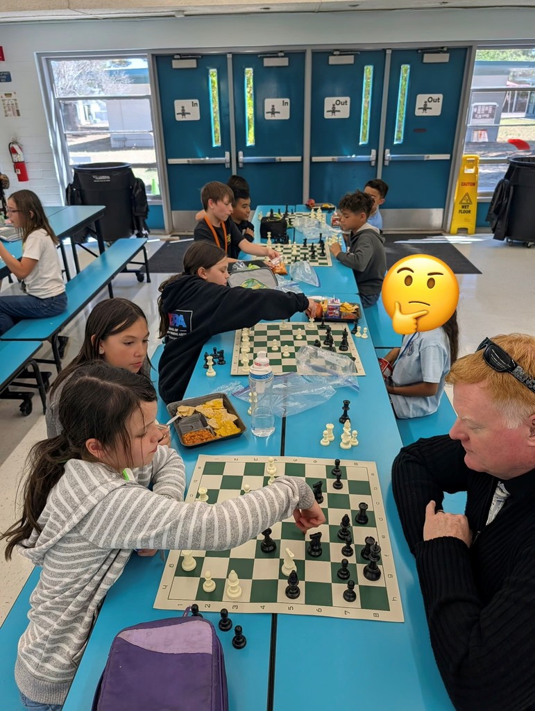 4th and 5th grade students play Chess while they eat lunch. 