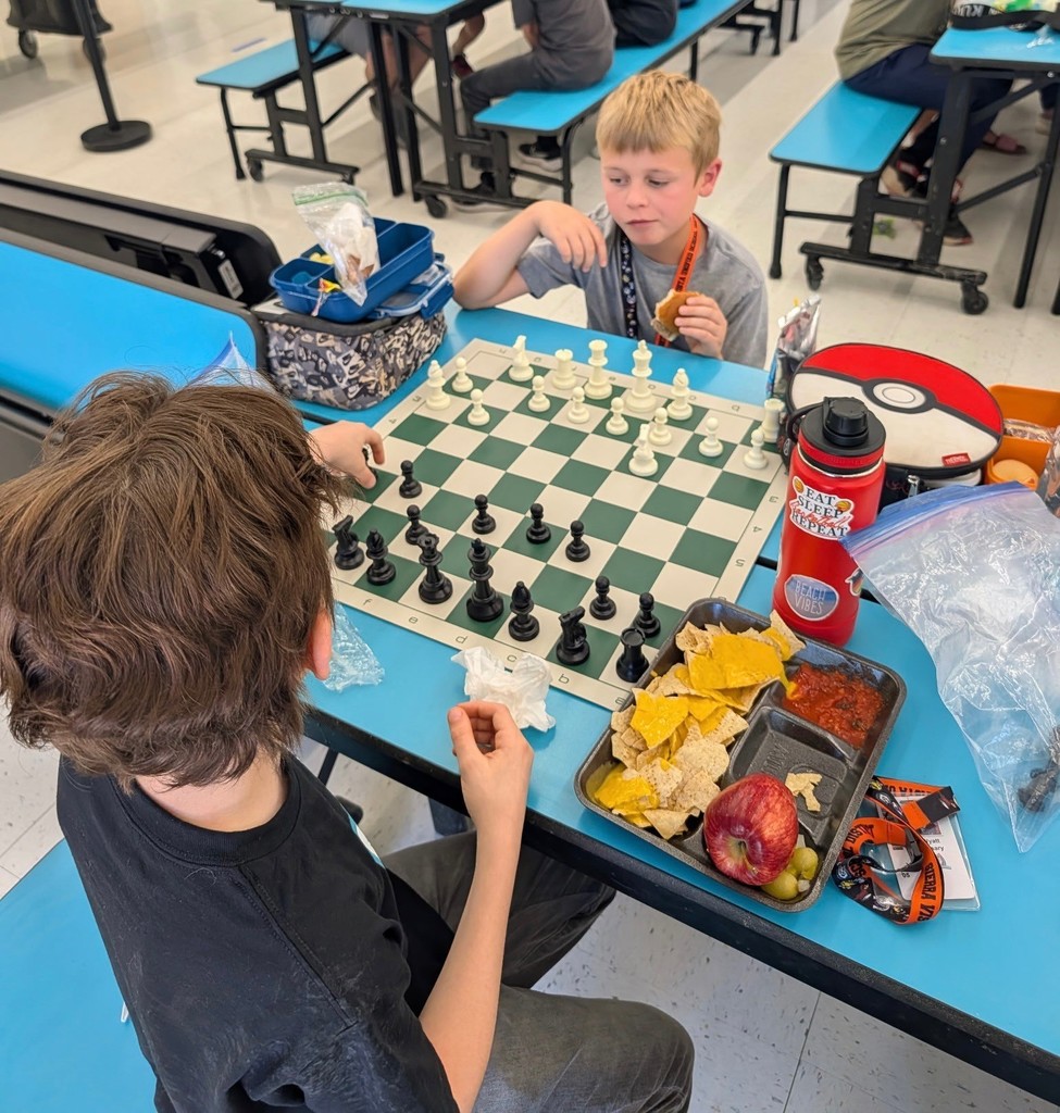 4th and 5th grade students play Chess while they eat lunch. 