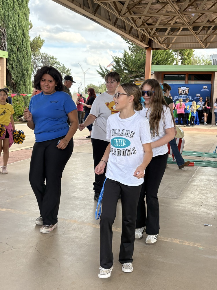 Village Meadows cheerleaders show up and cheer up the District Enrollment Fair. 