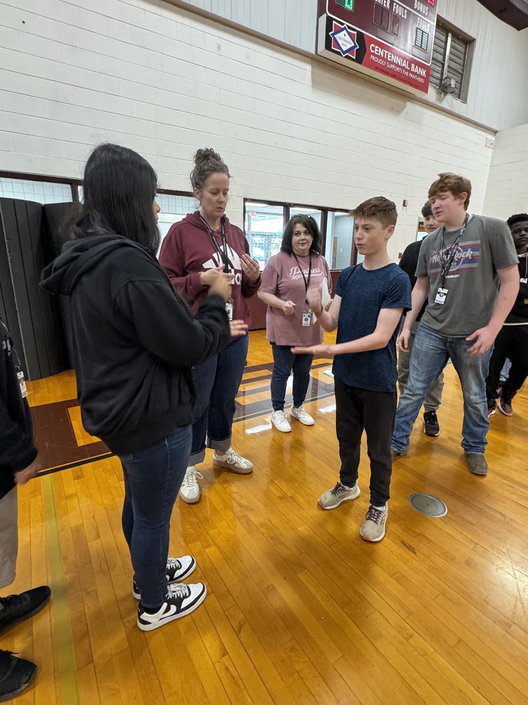 students playing rock, paper, scissors