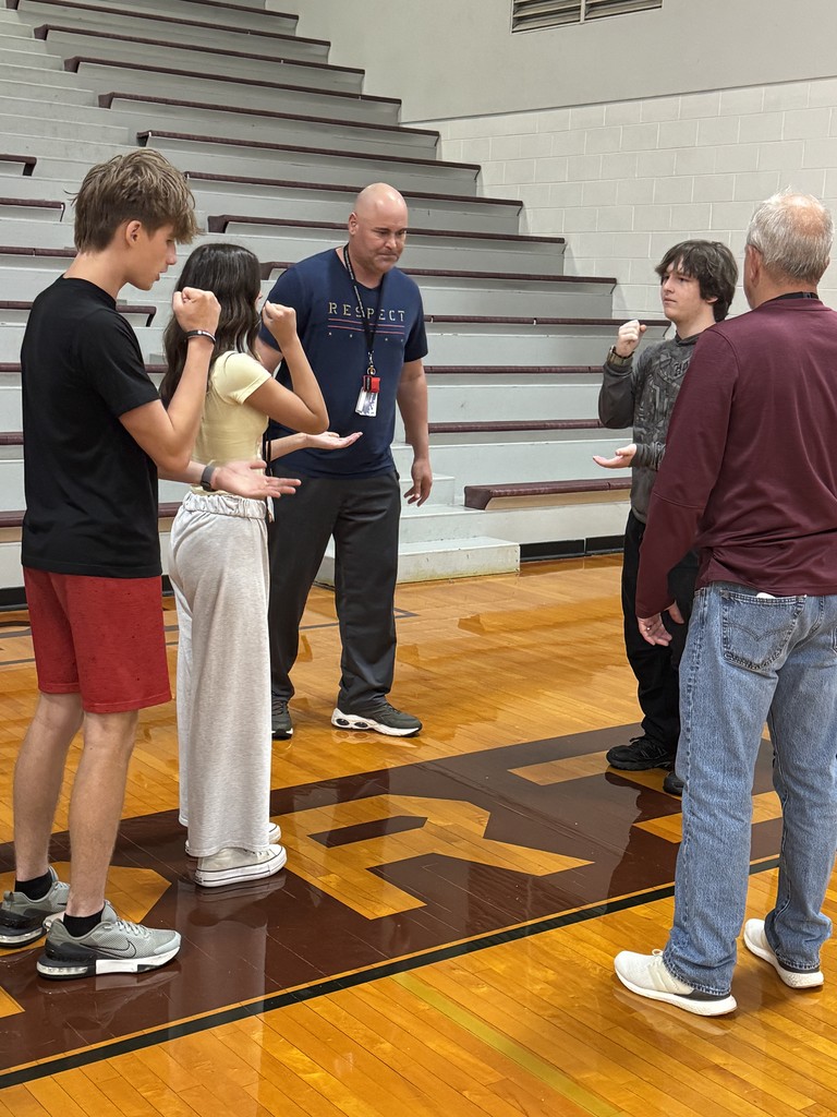 students playing rock, paper, scissors