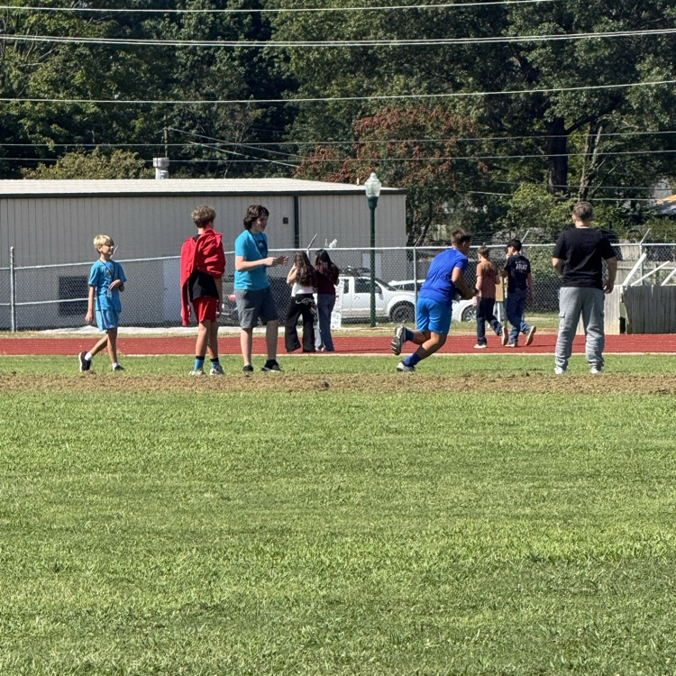 students playing football