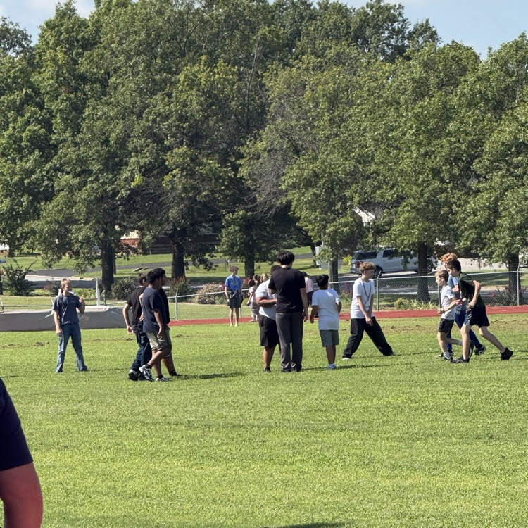 students playing football