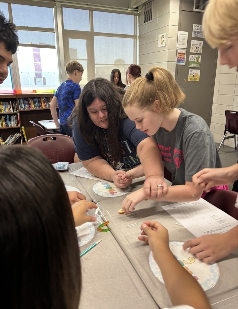 student working to save a gummy worm