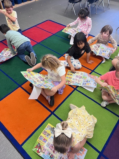 students looking at flyer