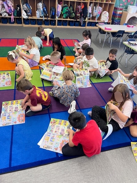 students looking at flyer