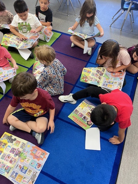 students looking at flyer