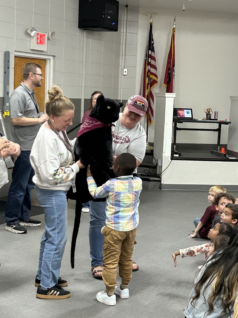 staff and student with stuffed panther