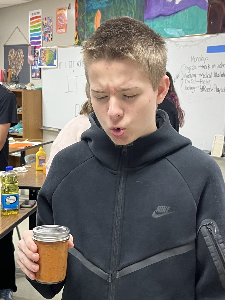 high school students doing a science experiment