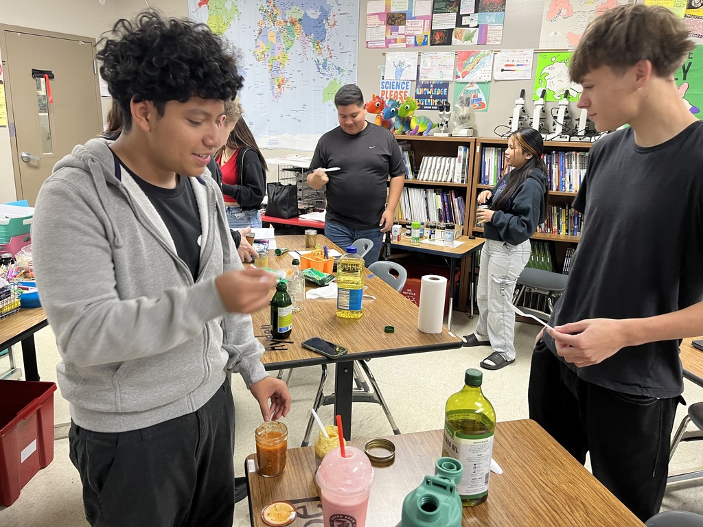 high school students doing a science experiment