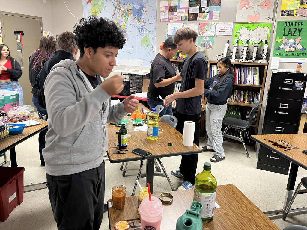 high school students doing a science experiment