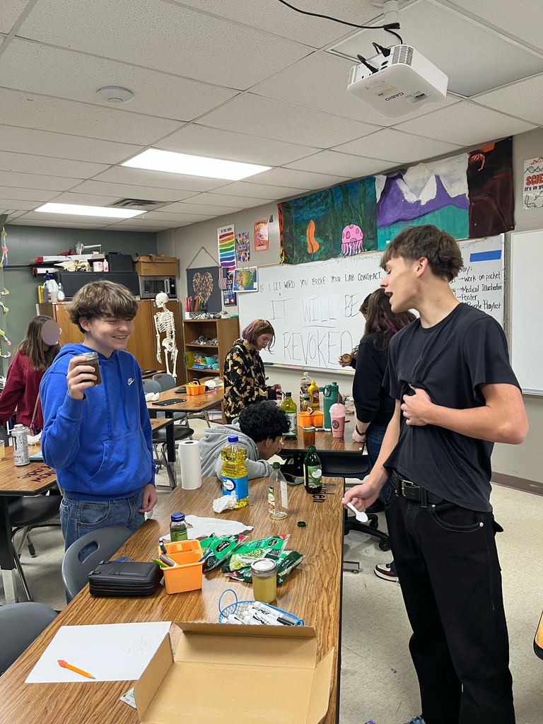 high school students doing a science experiment