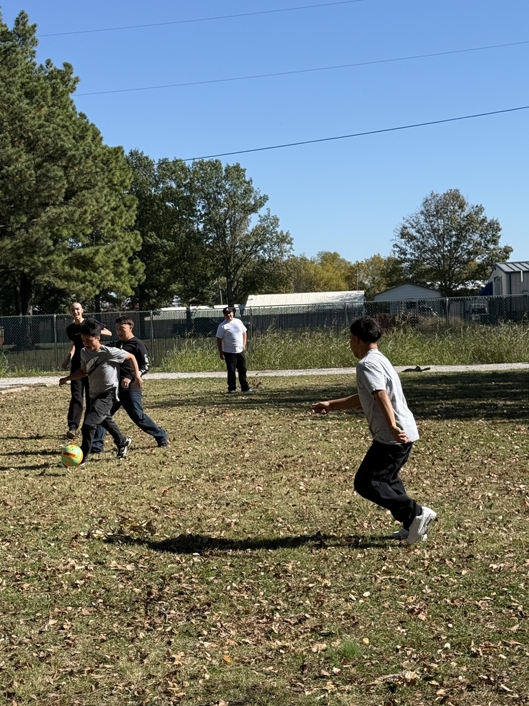 high school students playing soccer