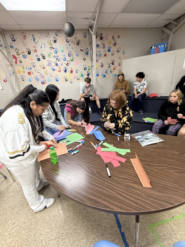 high school students working on art project