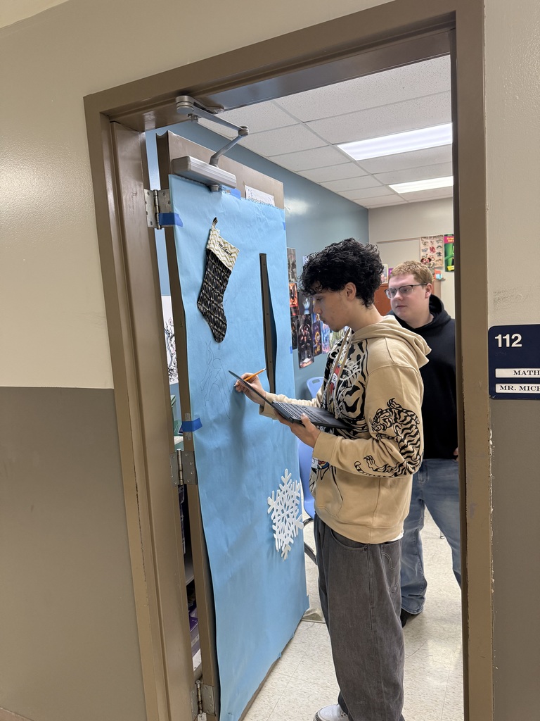 high school students decorating for the holidays