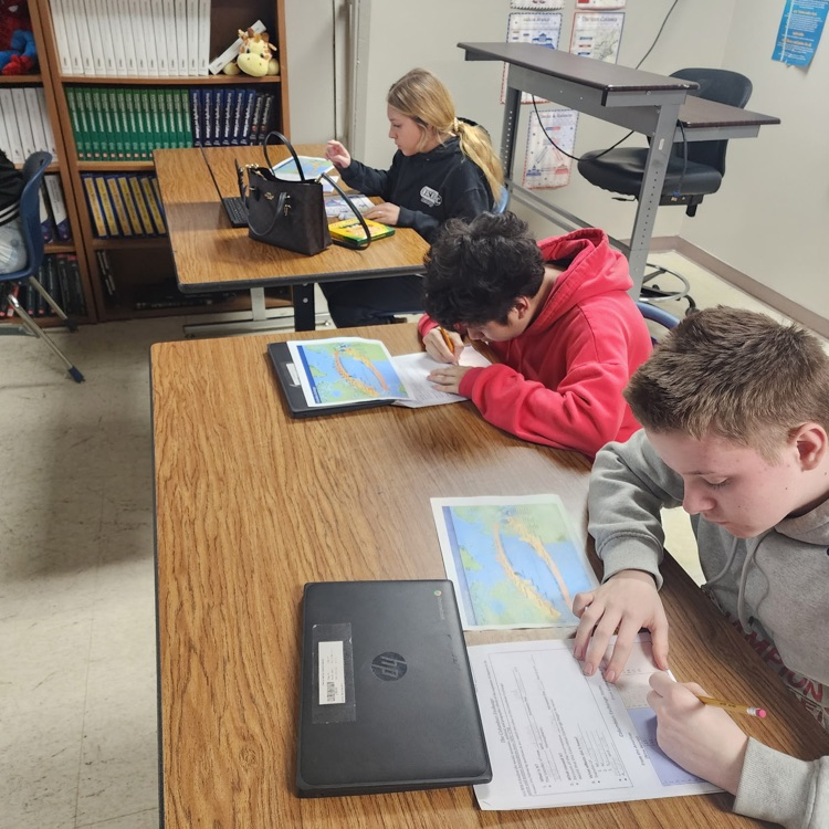 high school students working on a project