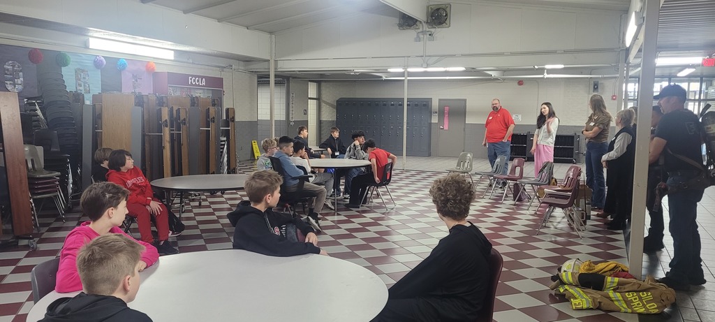 students listening to guest speakers
