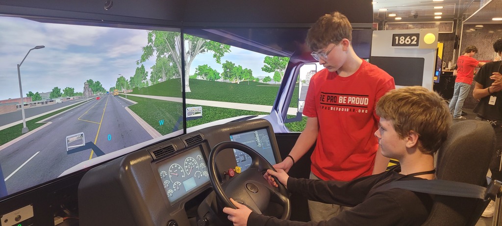 students in a driving simulator