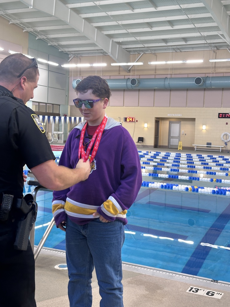 student receiving medal