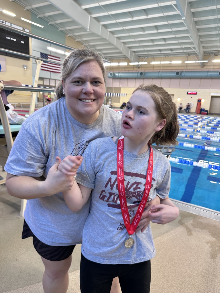 student receiving medal