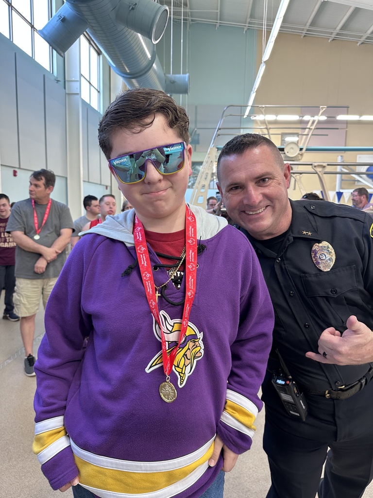 student receiving medal