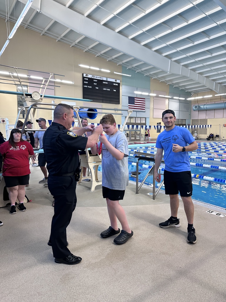 student receiving medal