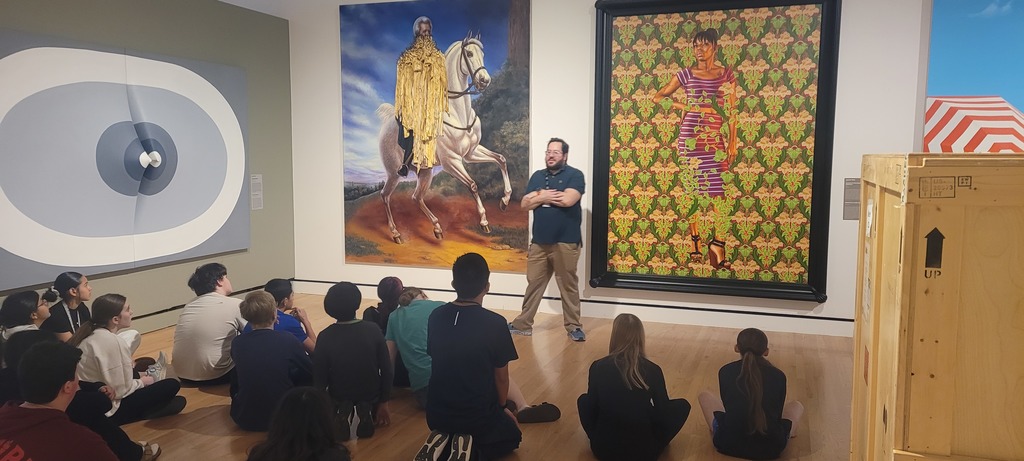 students studying art work