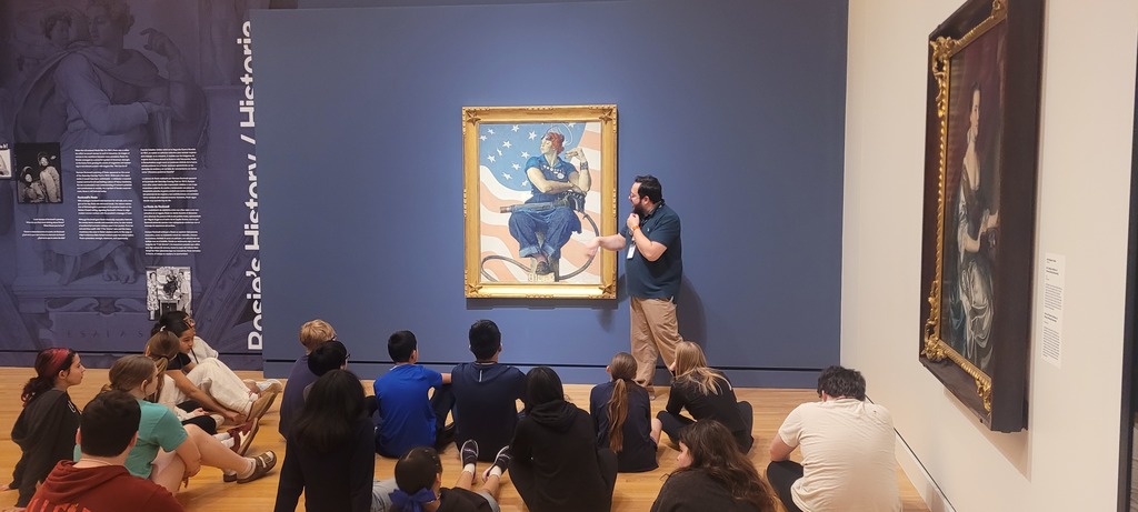 students studying art work