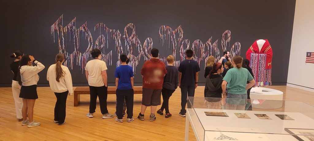 students studying art work