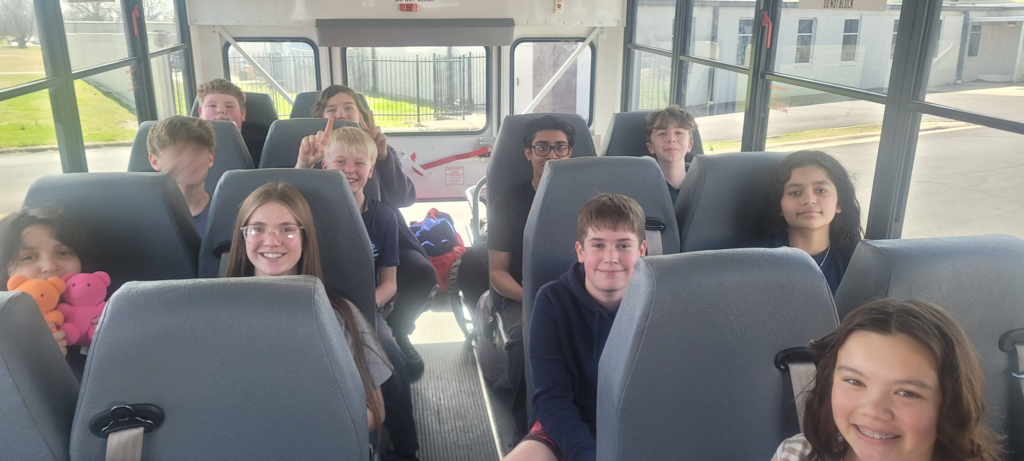 robotics students on a bus