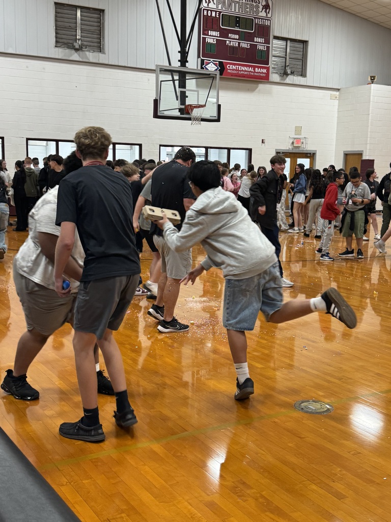 student throwing confetti egg