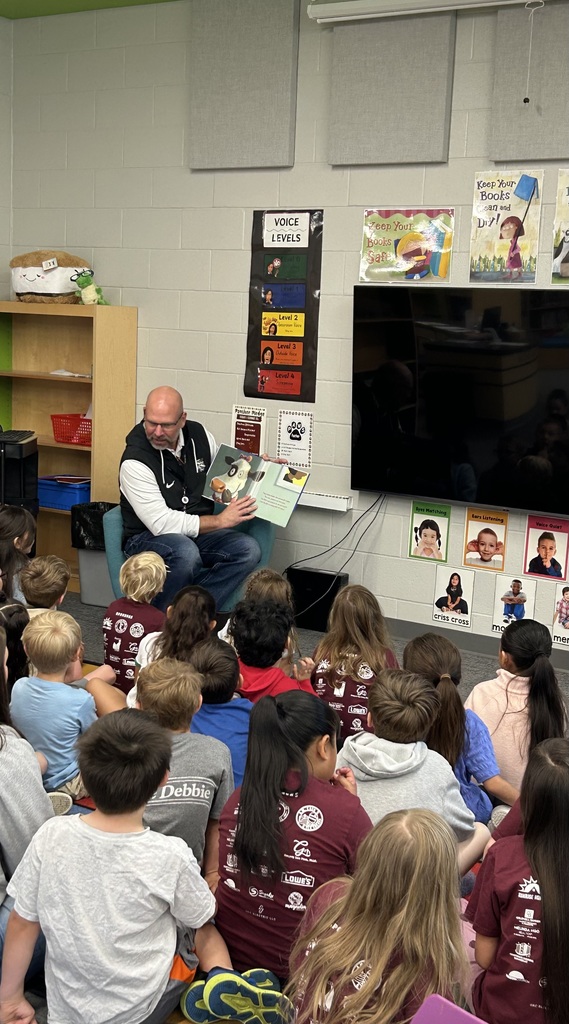 Mr. Patrick reading to a class of kindergarten students 