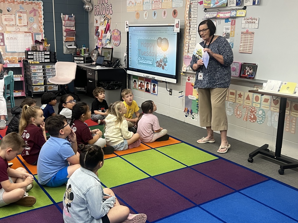 Mrs. Shoptaw reading to a class of kindergarten students 
