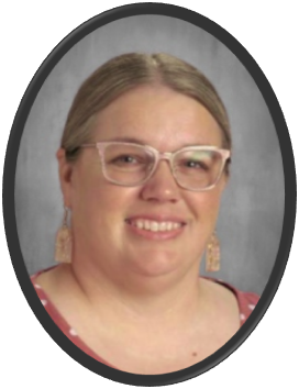 Woman with short hair, glasses, and a red polka dot shirt smiles inside an oval black frame.