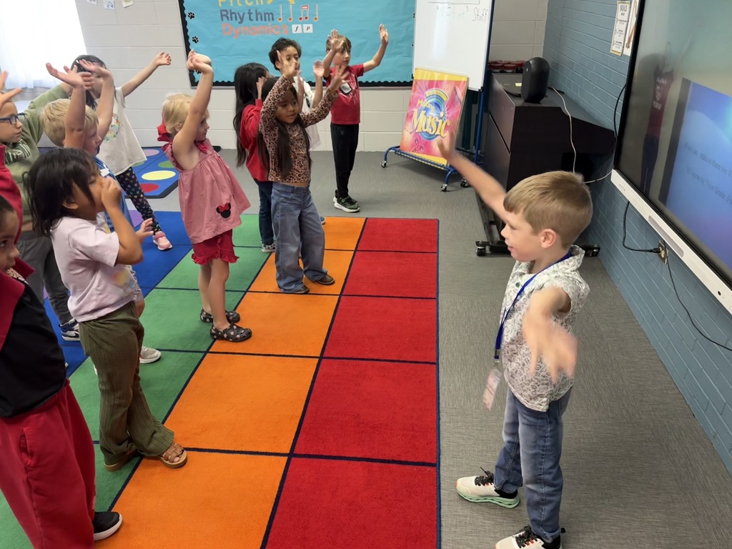 teacher for a day teaching music class to students