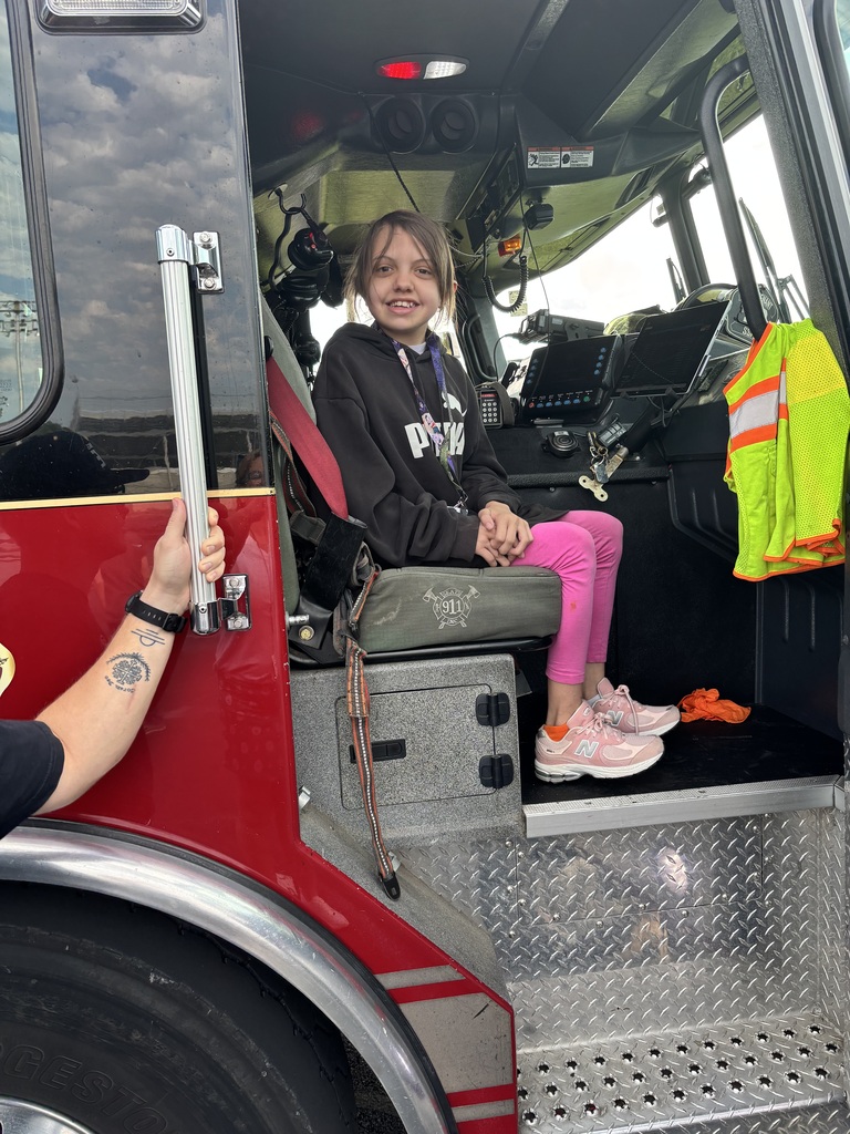 A student sitting in the Siloam Springs fire truck.