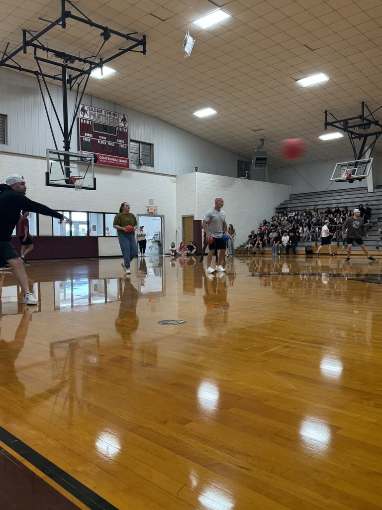 The group of teachers playing in the staff versus students volleyball game. 