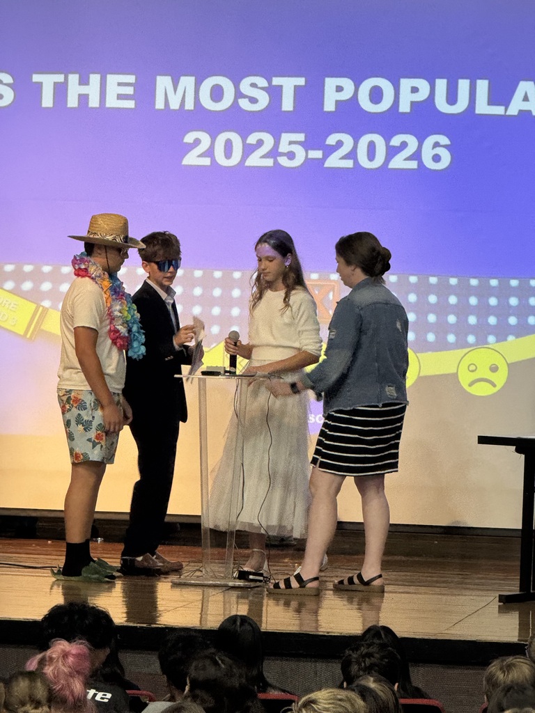 A student and Mrs. Marsh answering questions during family feud.