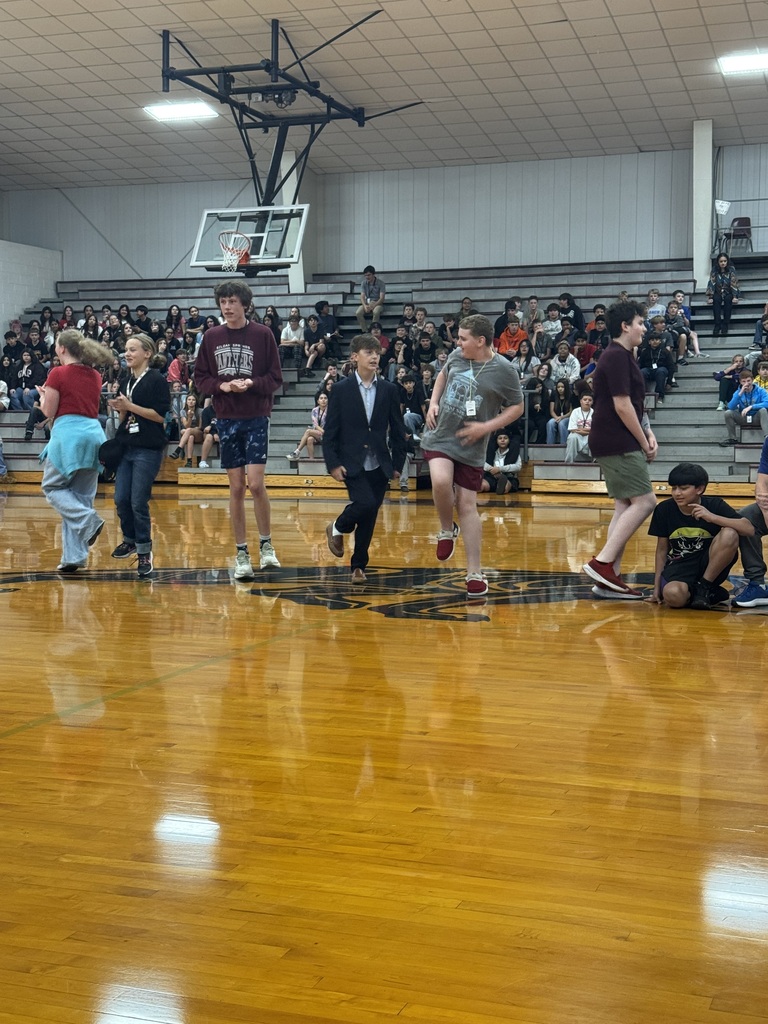 A group of students participating in Simon says during our relay races. 