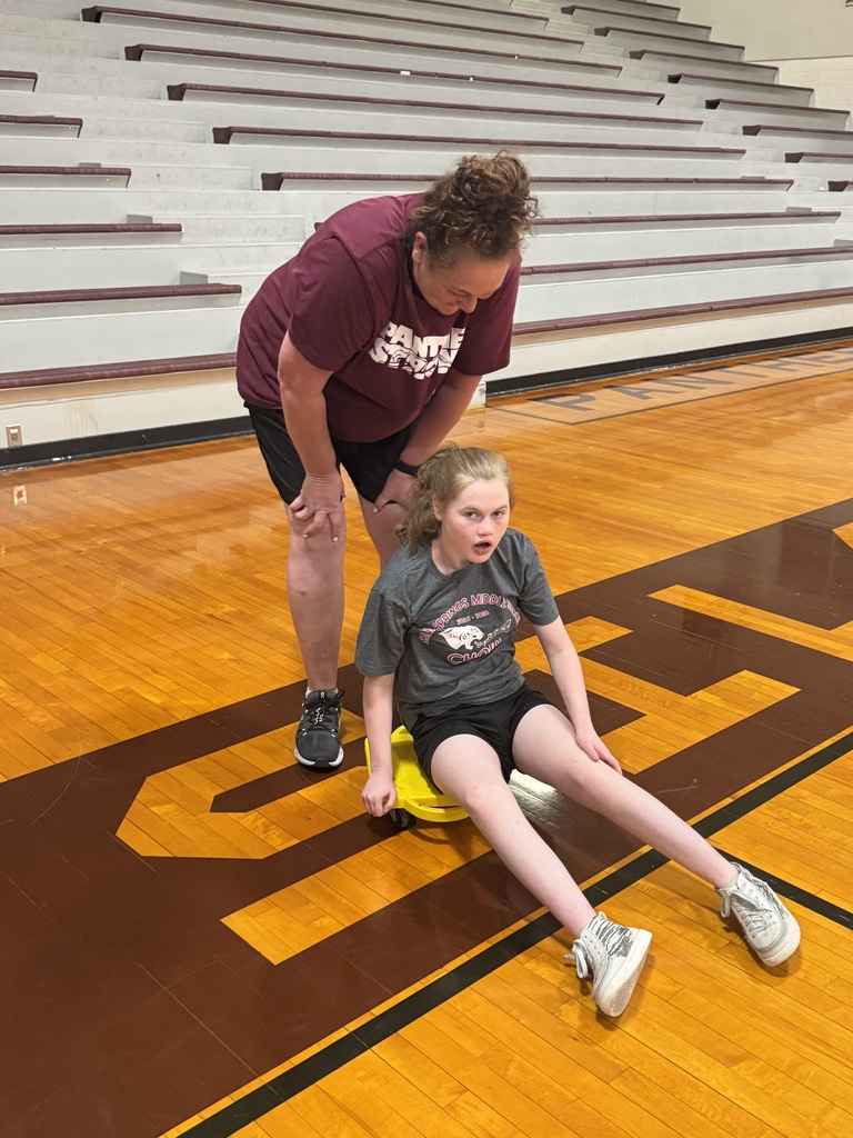 A student getting ready for her scooter relay race.