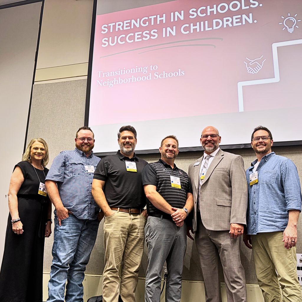 SSSD School Board and Superintendent Patrick stand in front of a presentation slide about schools.