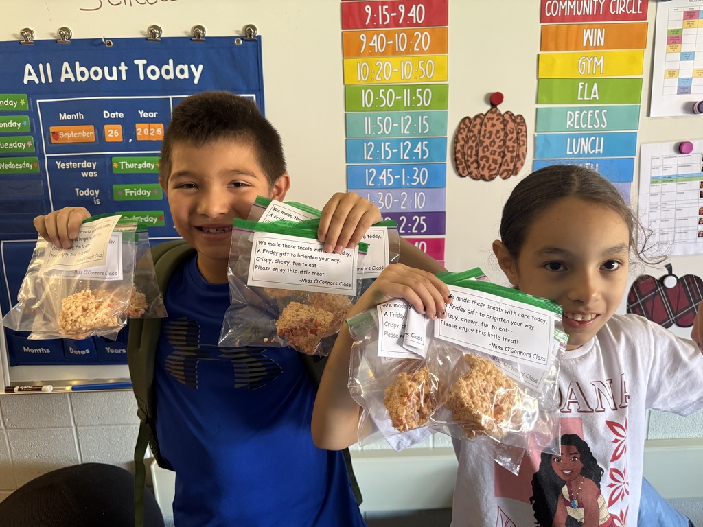 students holding bags of treats