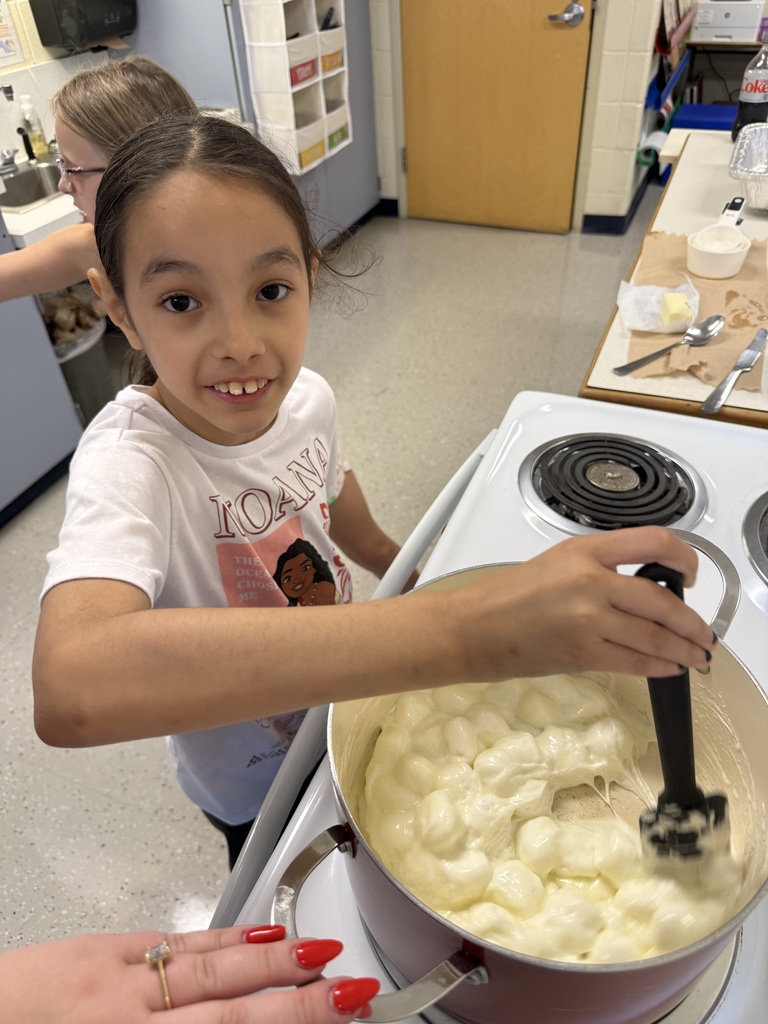 student stirring pot