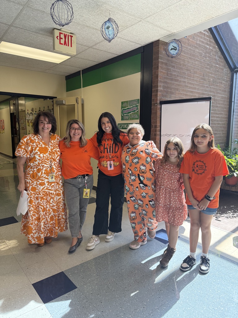 ES Staff and students in orange