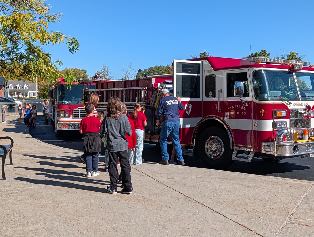 Students outside with fire trucks