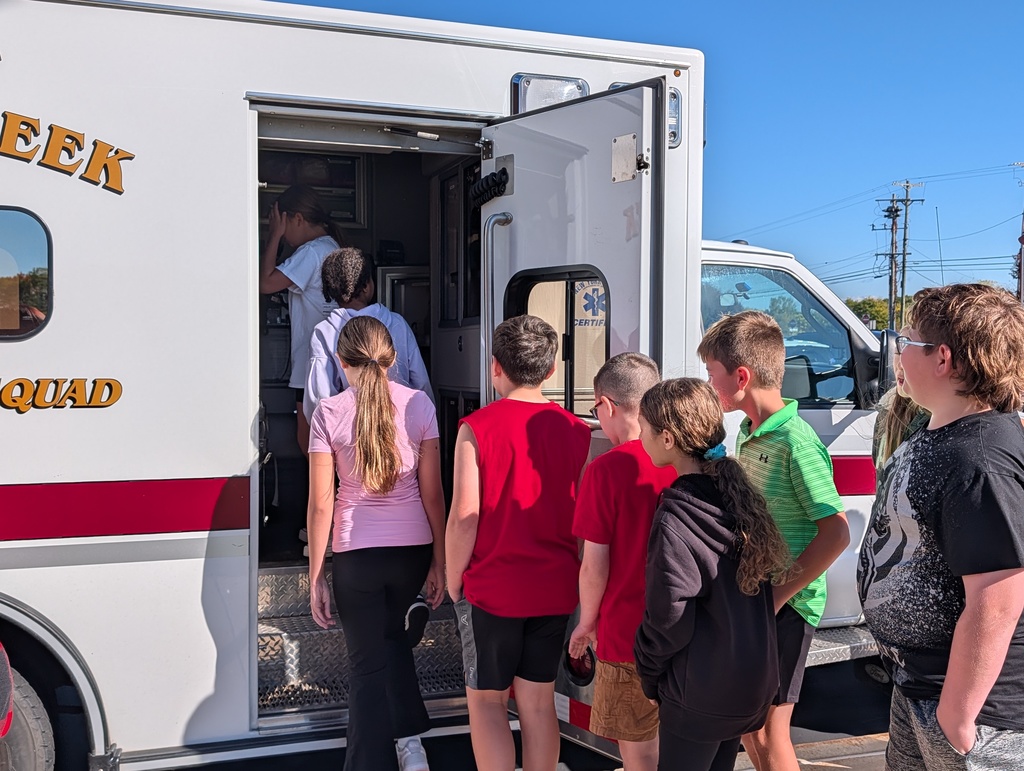 Students outside with fire trucks