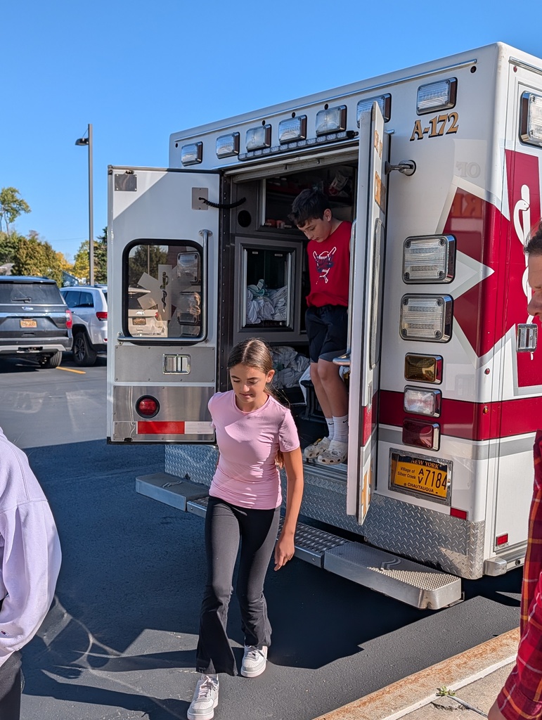 Students outside with fire trucks