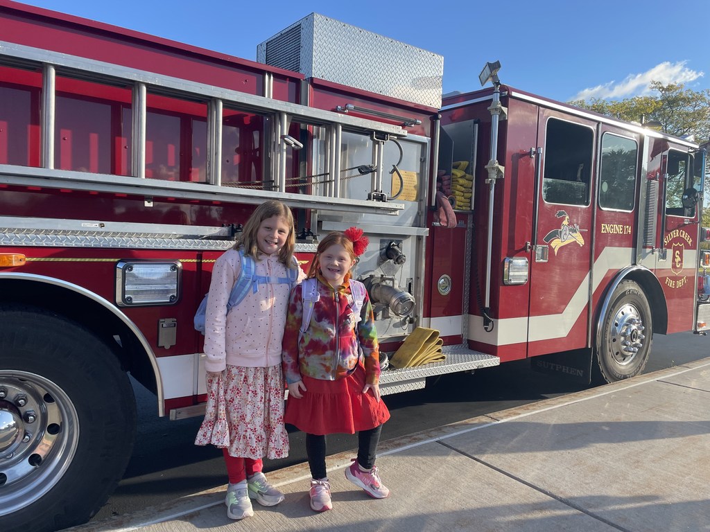 Students outside with fire trucks