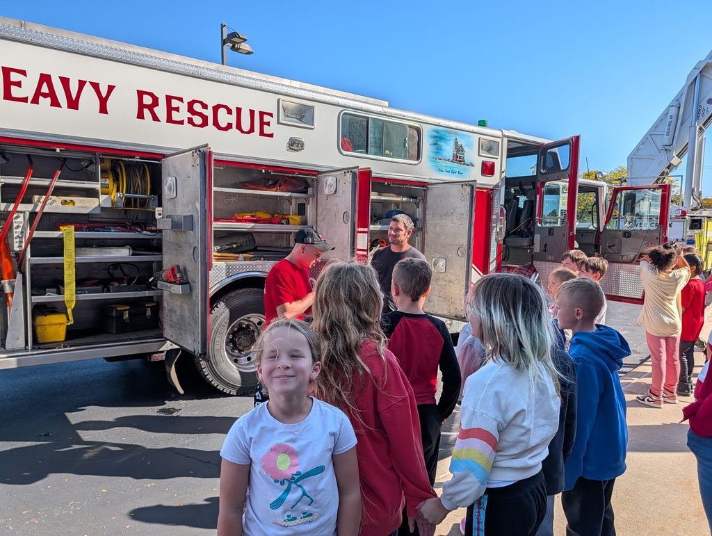 Students outside with fire trucks