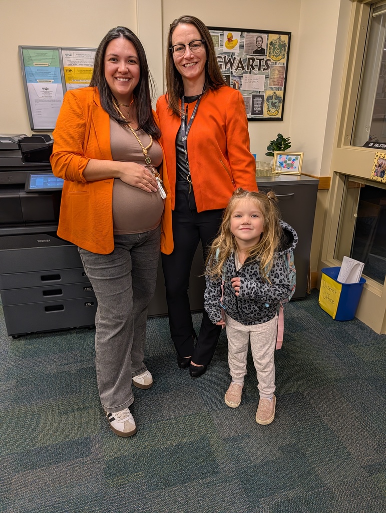 Mrs. Miller & Dr. Ralson in orange blazers